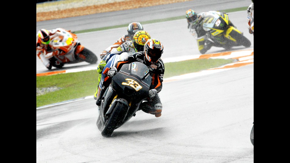Marco Melandri riding ahead of MotoGP group in Sepang