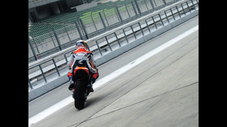 Akiyoshi Kosuke rides out of Pit Lane at the Sepang test