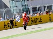 Casey Stoner pulls off a wheelie at the finish of the race at Motorland Aragón