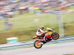 Andrea Dovizioso pulls off a wheelie during QP in Brno