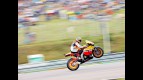 Andrea Dovizioso pulls off a wheelie during QP in Brno
