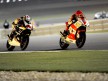Stefan Bradl and Shoya Tomizawa in action in Qatar