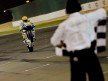 Valentino Rossi pulls off a wheelie at the finish of the race in Qatar