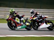 Toni Elias riding ahead of Tomizawa in Qatar