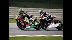 Toni Elias riding ahead of Tomizawa in Qatar