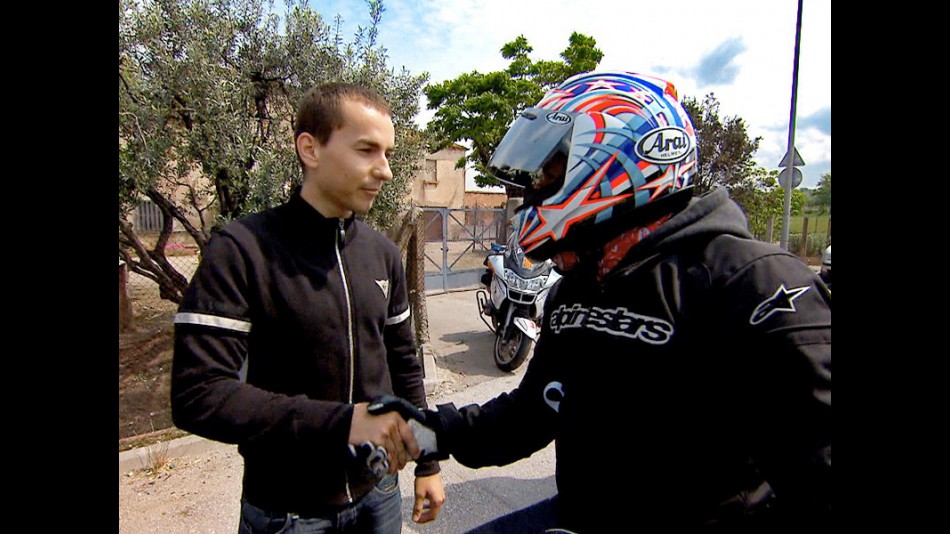 Jorge Lorenzo talks to a motorist about road safety