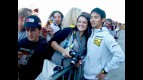 Hiroshi Aoyama attending fans at the paddock in Valencia