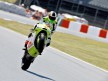 Aleix Espargaró pulls off a wheelie during FP1 at the Catalunya Circuit