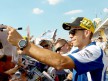 Valentino Rossi attending fans at the paddock in Sachsenring