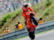 Casey Stoner pulls off a wheelie during QP in Brno