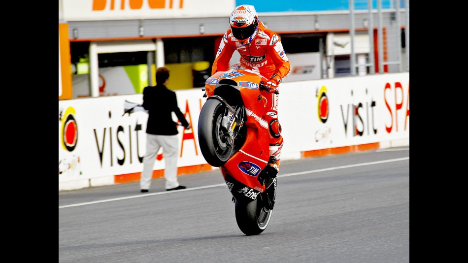 Casey Stoner pulls off a wheelie after the race at Motegi