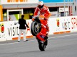 Casey Stoner pulls off a wheelie after the race at Motegi