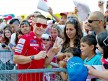 Nicky Hayden attending fans at the paddock in Misano