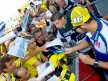 Valentino Rossi attending fans at the paddock in Misano
