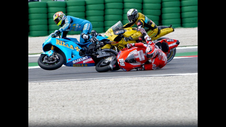 Capirossi and Hayden crash during the race at Misano