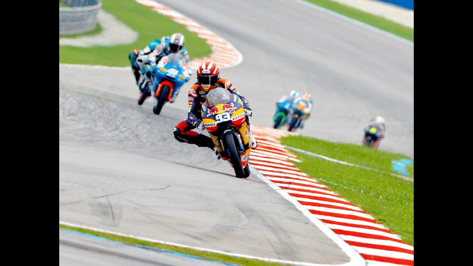 Marc Marquez riding ahead of 125cc group at Sepang