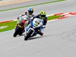 Roberto Rolfo riding ahead of Alex de Angelis at Sepang