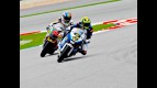 Roberto Rolfo riding ahead of Alex de Angelis at Sepang