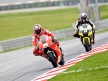 Nicky Hayden riding ahead of Spies at Sepang