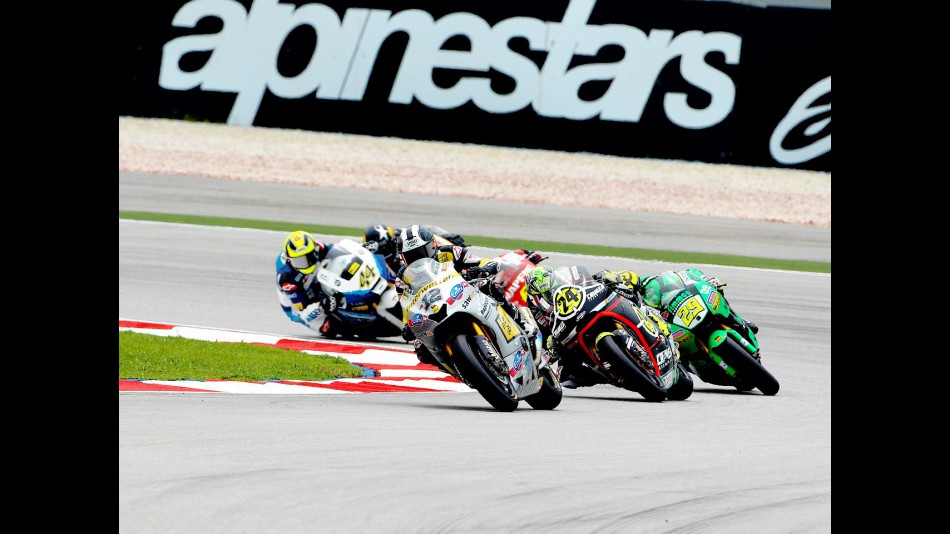 Thomas Luthi riding ahead of Moto2 group at Sepang