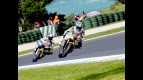 Alex de Angelis riding ahead of Takahashi at Phillip Island