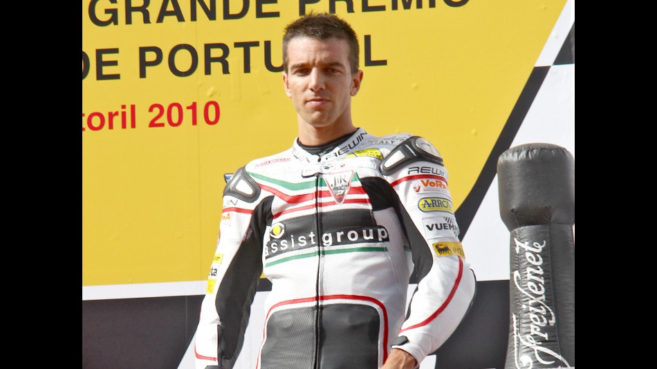 Alex de Angelis on the podium at Estoril