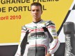Alex de Angelis on the podium at Estoril