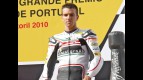 Alex de Angelis on the podium at Estoril