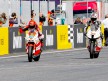 Stefan Bradl finish the Moto2 race ahead of Baldolini at Estoril