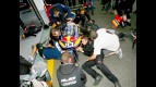 Red Bull Ajo Motorsport staff working on Márquez's bike at Estoril