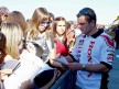 Randy de Puniet attending fans at the paddock in Valencia