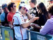 Marco Melandri attending fans at the paddock in Valencia