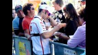 Marco Melandri attending fans at the paddock in Valencia