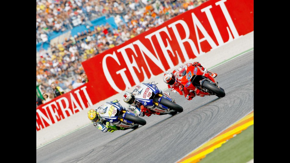Stoner, Lorenzo and Rossi in action in Valencia