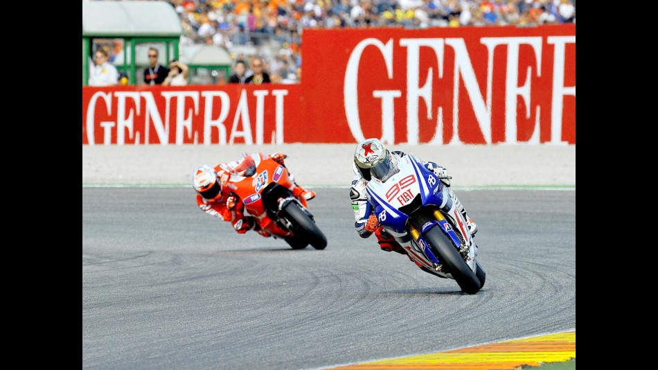 Lorenzo riding ahead of Stoner in Valencia