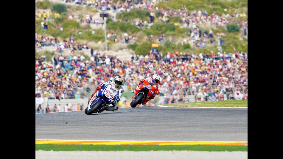 Lorenzo riding ahead of Stoner in Valencia