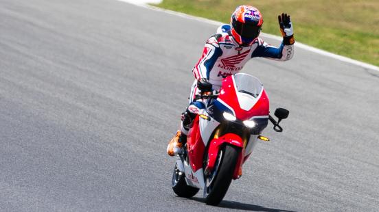 Casey Stoner takes a lap of honour on the new road-legal MotoGP replica, the Honda RC213V-S.