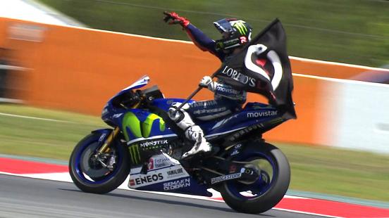 Jorge Lorenzo leads home teammate Valentino Rossi to claim his fourth consecutive victory as Marc Marquez crashes out.