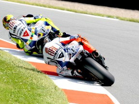 Valentino Rossi riding ahead of Jorge Lorenzo in Sachsenring