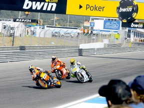 Pedrosa riding ahead of Stoner and Rossi at Estoril