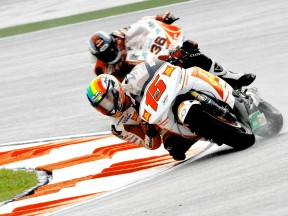 De Angelis riding ahead of Kallio in Sepang