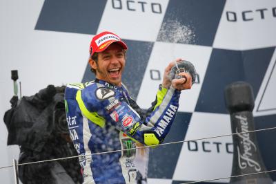 Rain-master Rossi re-takes championship lead
